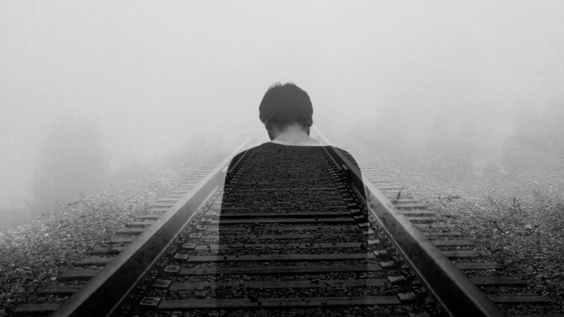 grayscale photo of man wearing black shirt